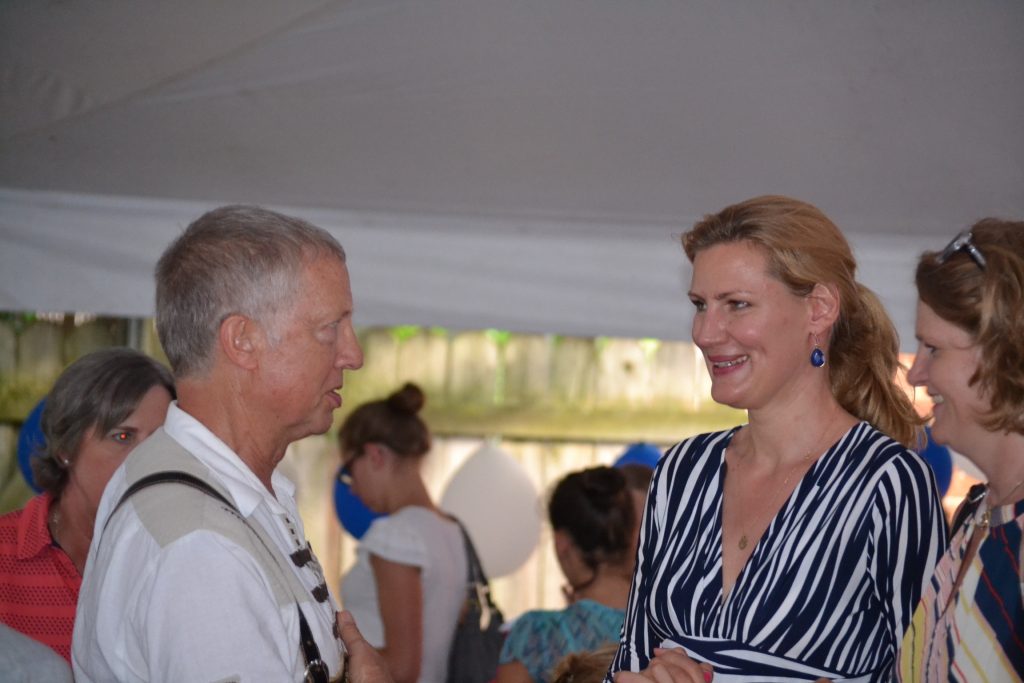 Alexa von Kuensberg a parishioner at sister parish St. Peter in Munich, spends time at the reception. (CT Photo/Greg Hartman)