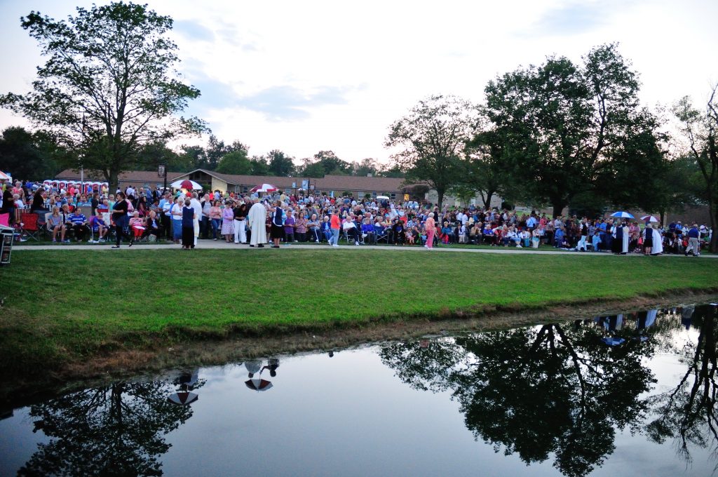 Umbrella's marked Communion Stations during Mass (CT Photo/Jeff Unroe)