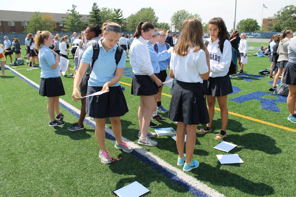 Mount Notre Dame students gathered on the athletic field to take in the partial eclipse (Courtesy Photo)