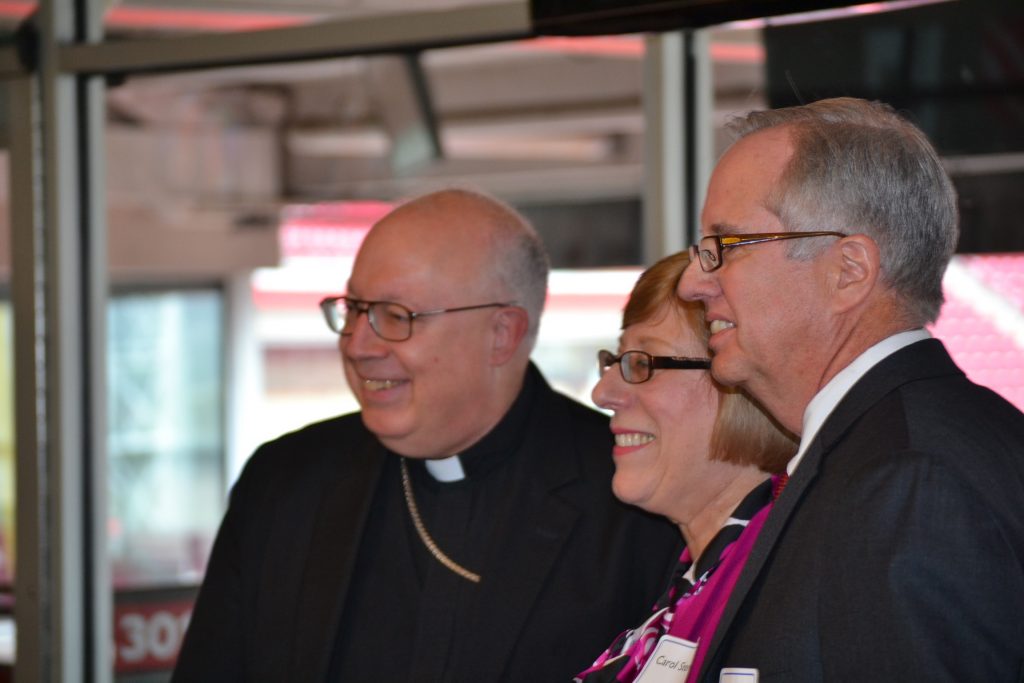 Bishop Binzer presents Carol & Richard Stevie with the Faith in Education Award. (CT Photo/Greg Hartman)