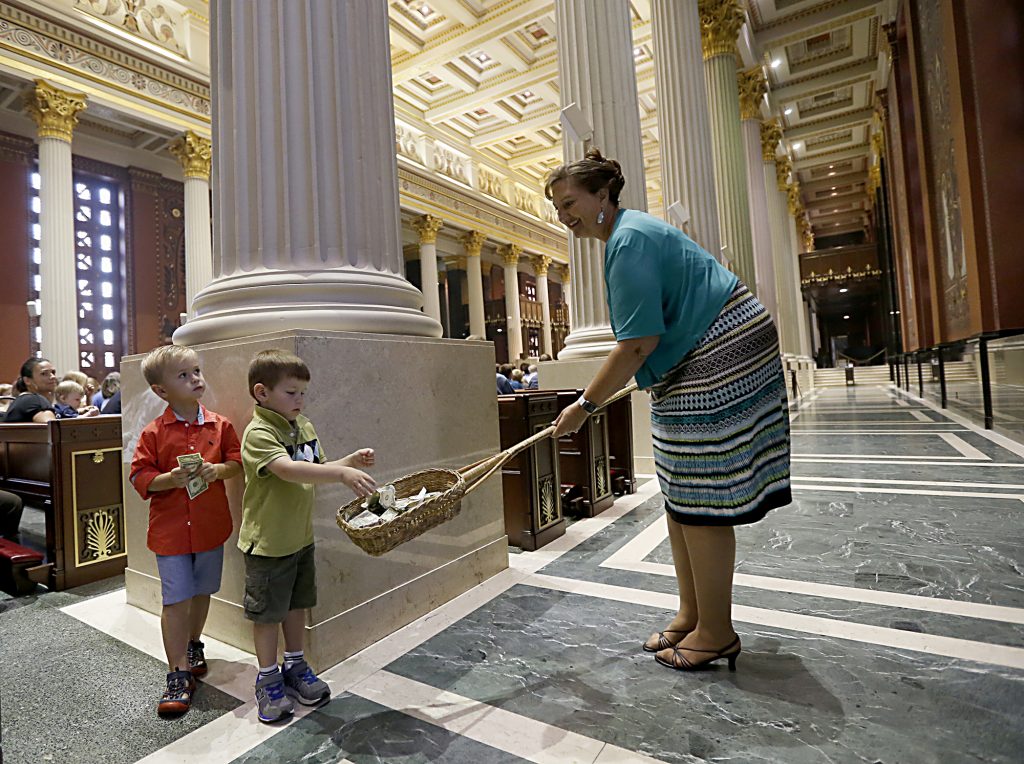 Jesse Mikesell, 4, and Brady Simonaeu, 3, give their offering during the Golden Wedding Anniversary Celebration at the Cathedral of Saint Peter in Chains in Cincinnati Saturday, Aug. 12, 2017. (CT Photo/E.L. Hubbard)