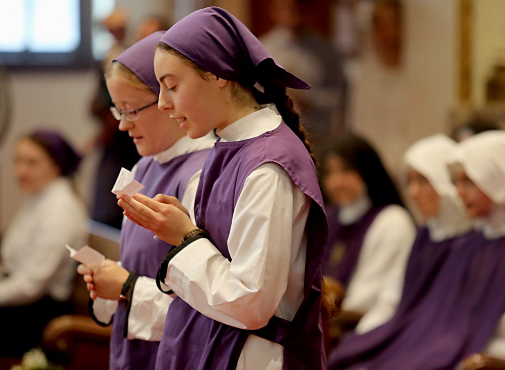 Postulants Sr. Laura and Sr. Ciara recite their intentions for the Ceremony of Investiture during the Feast of the Presentation of Mary at Our Lady of the Holy Spirit Center in Norwood Tuesday, Nov. 21, 2017. (CT Photo/E.L. Hubbard)