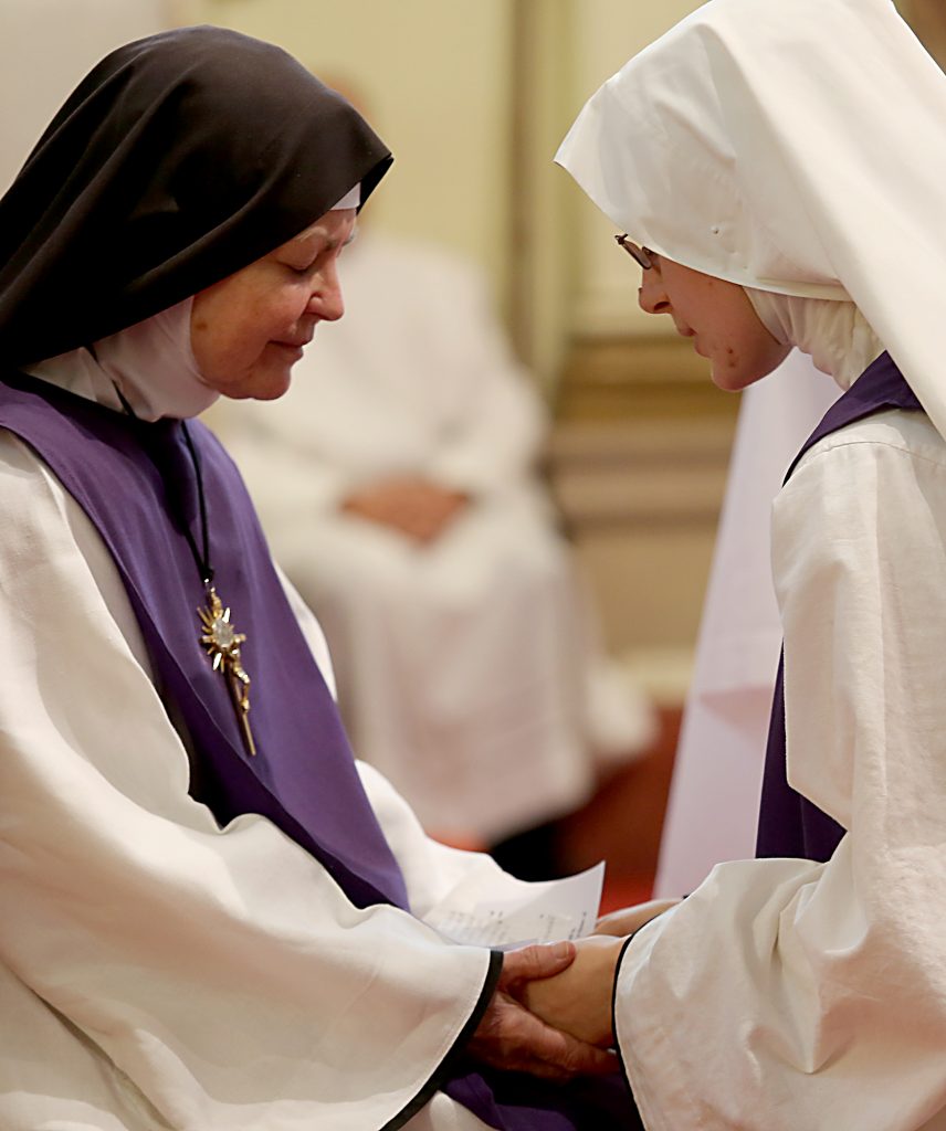 Mother Margaret Mary listens to Sr. Mary Consolata profess her vows for the Ceremony of First Profession during the Feast of the Presentation of Mary at Our Lady of the Holy Spirit Center in Norwood Tuesday, Nov. 21, 2017. (CT Photo/E.L. Hubbard)