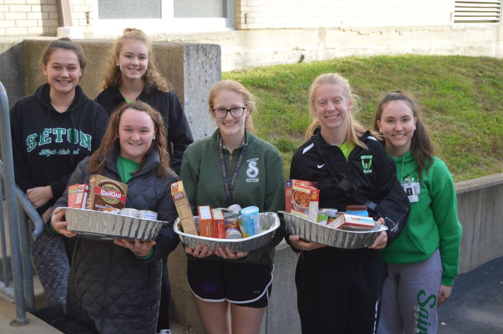 Students at Seton High School at hard work preparing Thanksgiving Dinners