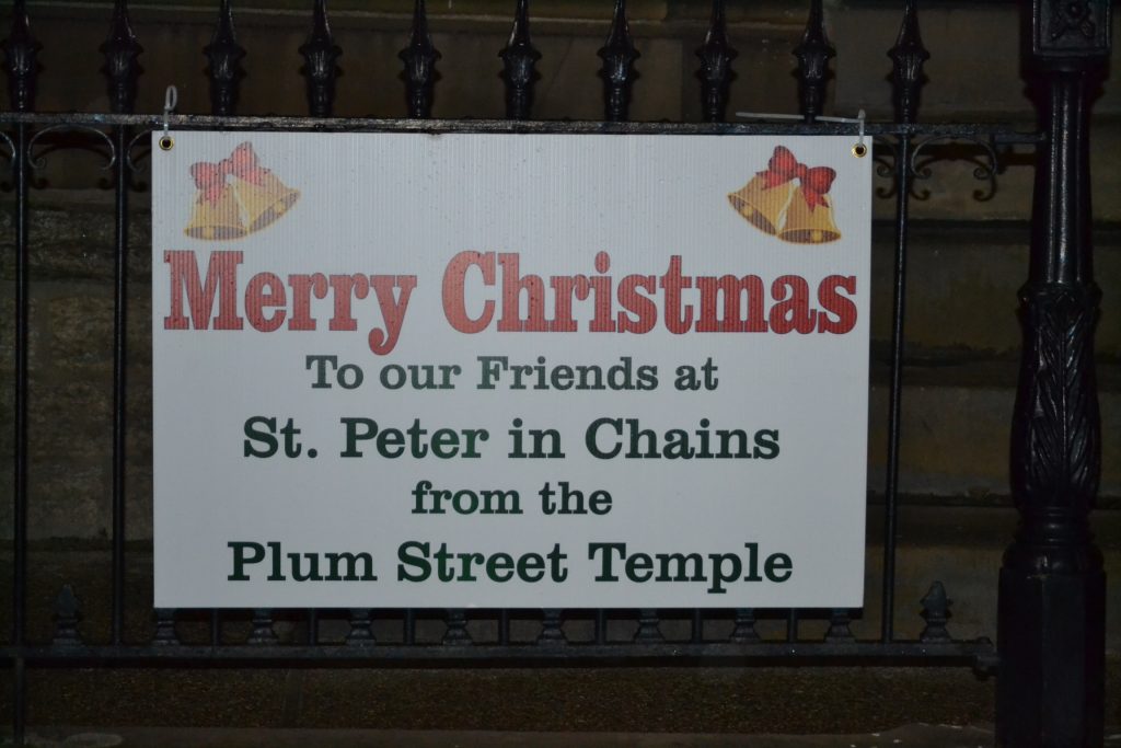 The Plum Street Jewish Temple across the street from St. Peter in Chains Cathedral sends Merry Christmas Greetings (CT Photo/Greg Hartman)