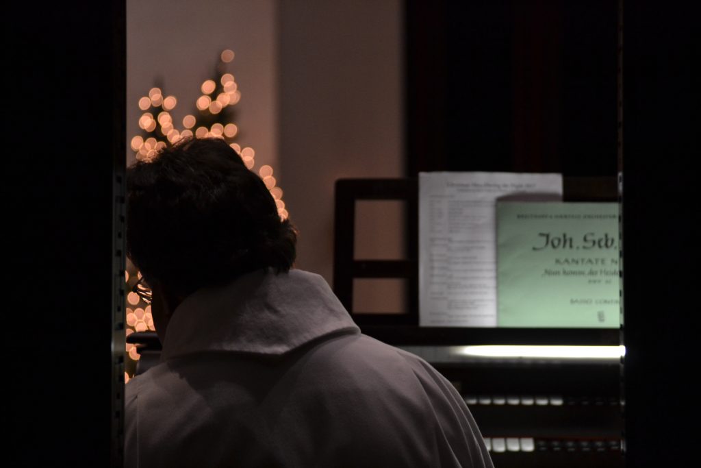 Blake Callahan, organist for St. Peter in Chains Cathedral, begins with a prelude to Midnight Mass. (CT Photo/Greg Hartman)