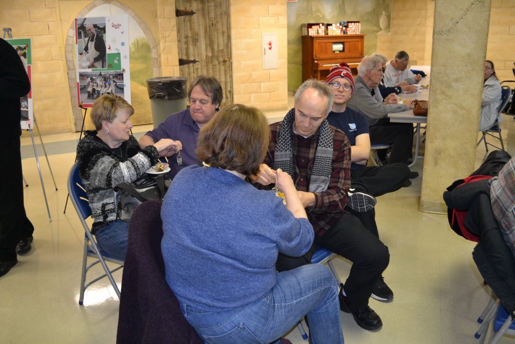 Guests enjoy the Father Kyle's specialties. (CT Photo/Greg Hartman)