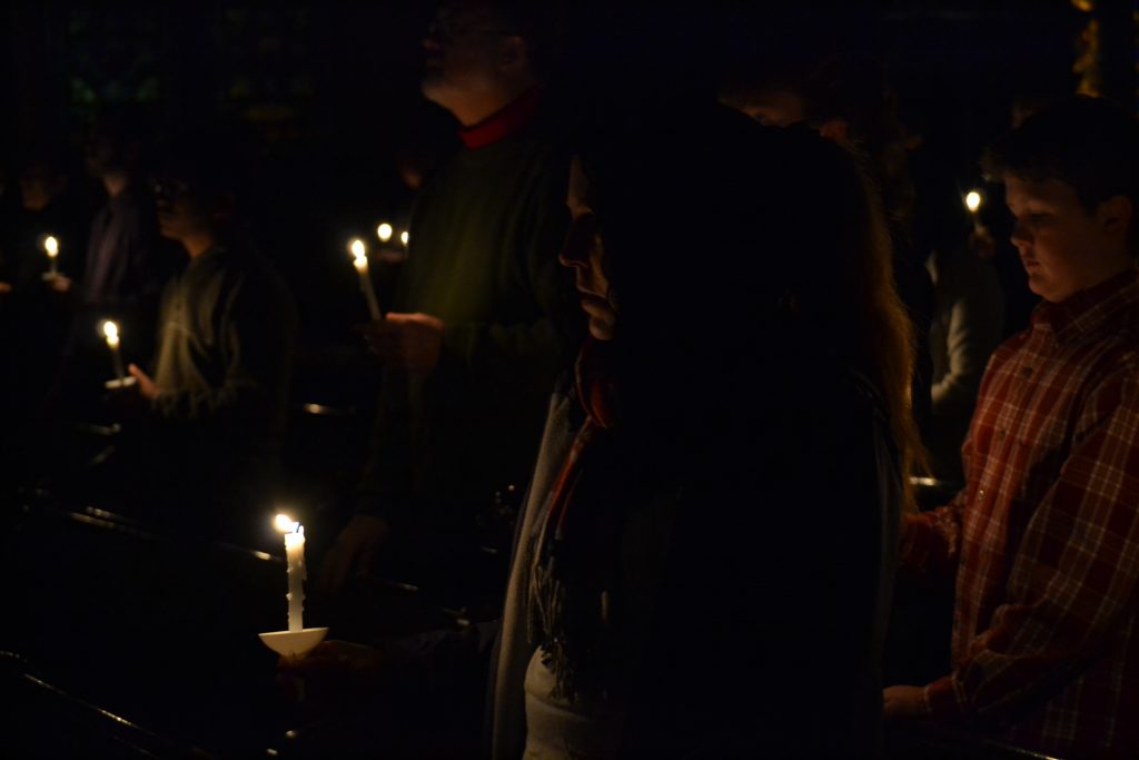Points of light in a darkened church (CT Photo/Greg Hartman)