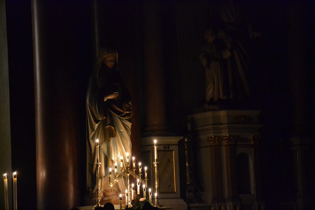 The Blessed Mother in candlelight (CT Photo/Greg Hartman)