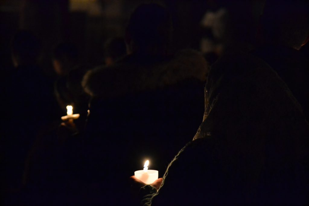 The darkness is broken by candle light. (CT Photo/Greg Hartman)