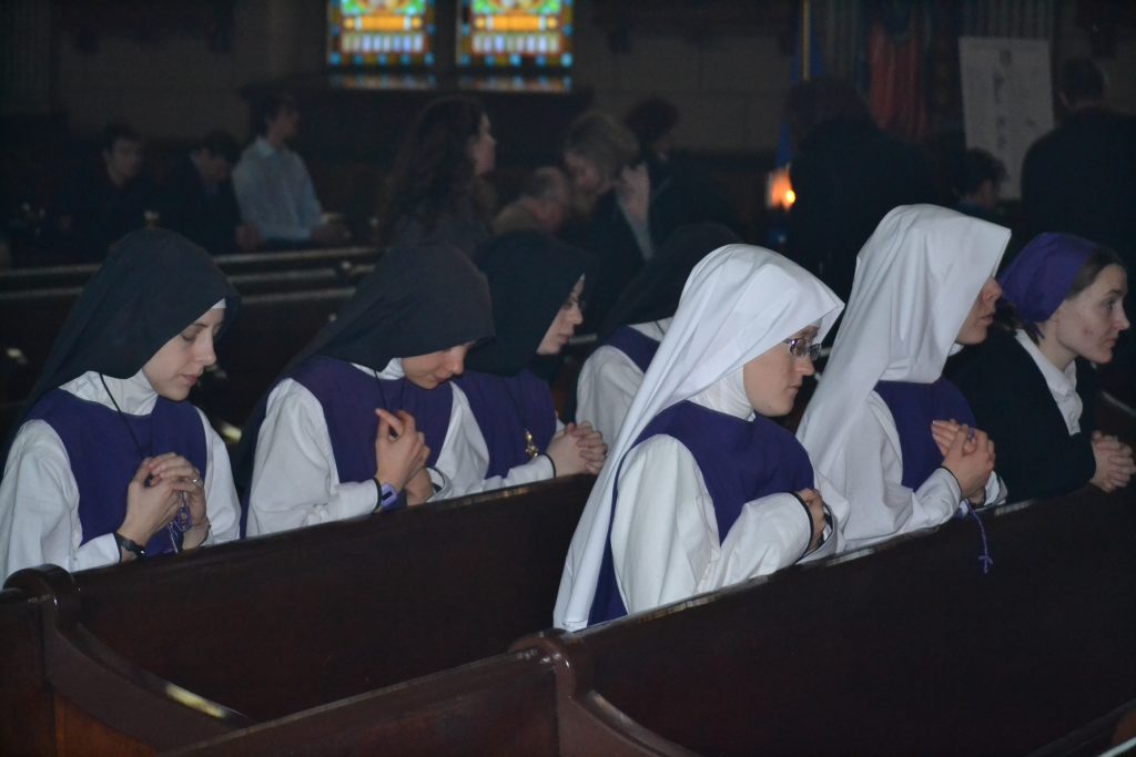 Daughters of Saint Paul in prayer after the Rorate Mass (CT Photo/Greg Hartman)
