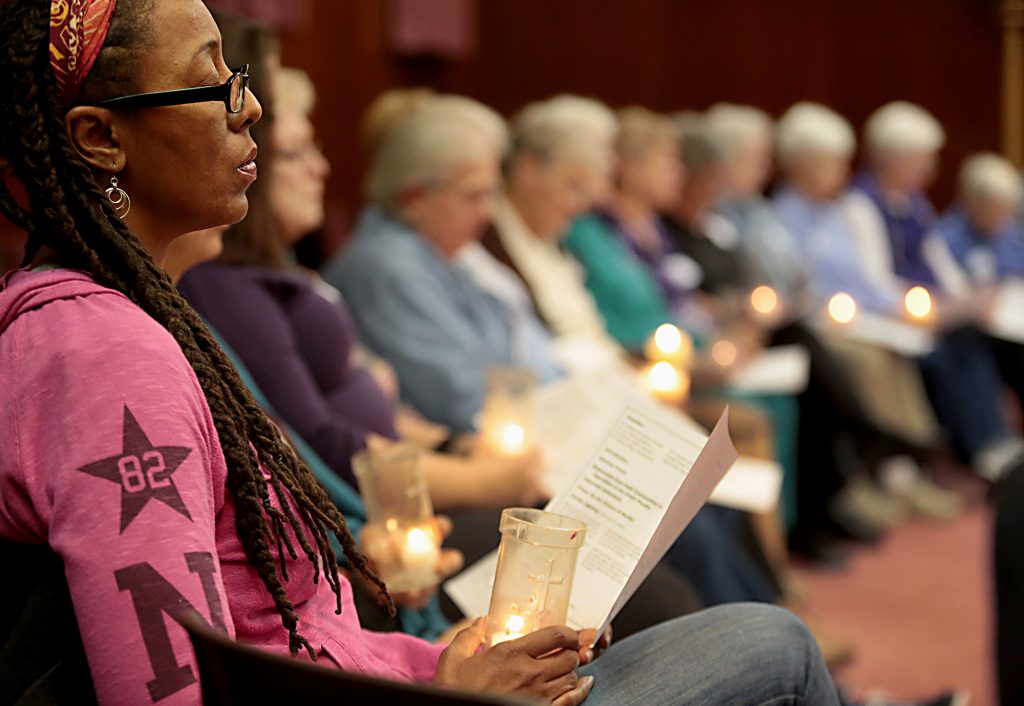 Deborah Robinson, from New Thought Unity Center in Cincinnati, holds her candle during the interfaith Cities for Life Prayer Vigil to End the Use of the Death Penalty at St. Peter in Chains Cathedral in Cincinnati Thursday, Nov. 30, 2017. (CT Photo/E.L. Hubbard)