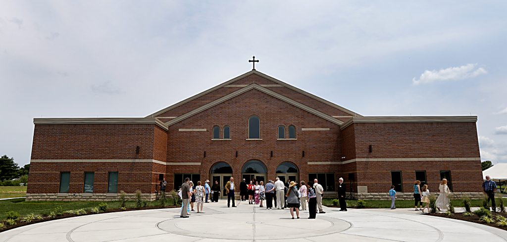 Parishioners begin to gather in front of their new building for the dedication of St. John the Baptist Church in Harrison Saturday, June 1, 2019. (CT Photo/E.L. Hubbard)