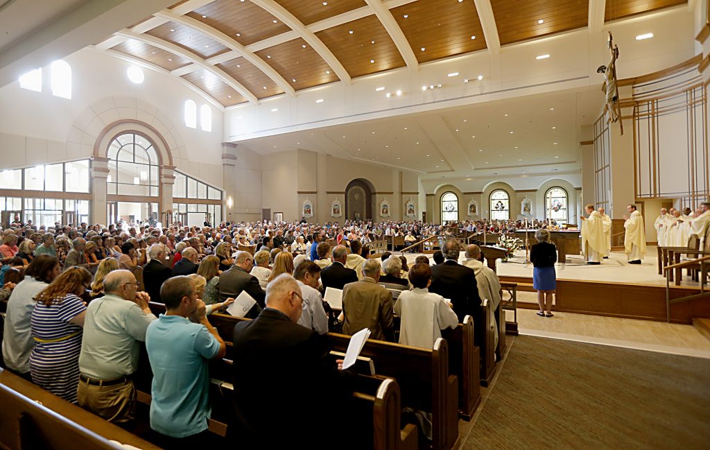 Archbishop Dennis Schnurr prepares the Holy Eucharist during the dedication of St. John the Baptist Church in Harrison Saturday, June 1, 2019. (CT Photo/E.L. Hubbard)