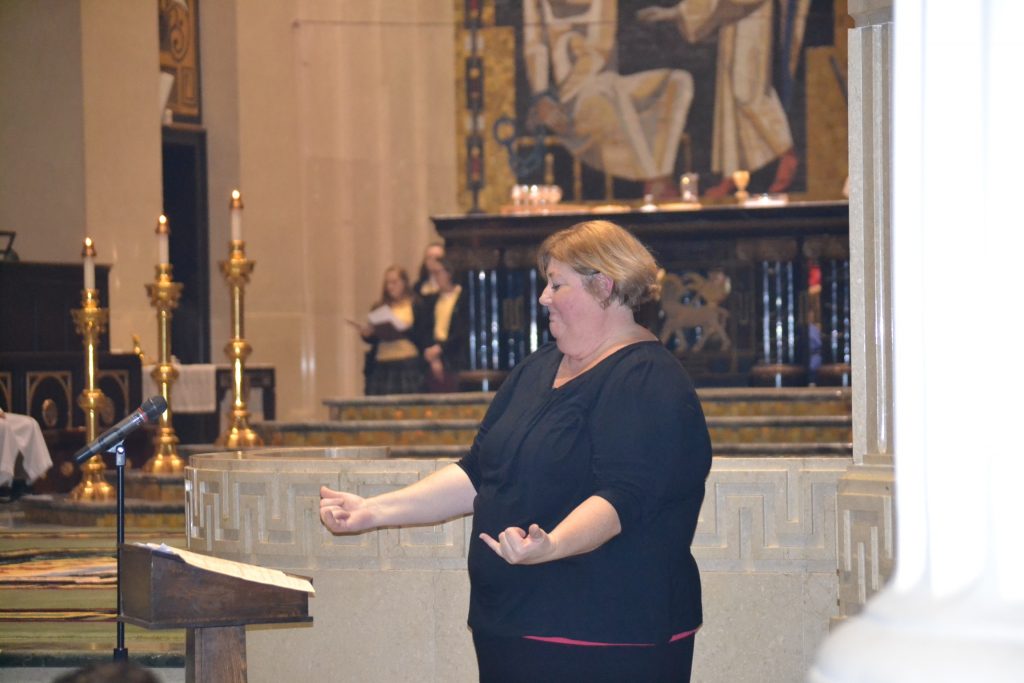 Signing at the Catholic Schools Week Mass (CT Photo/Greg Hartman)