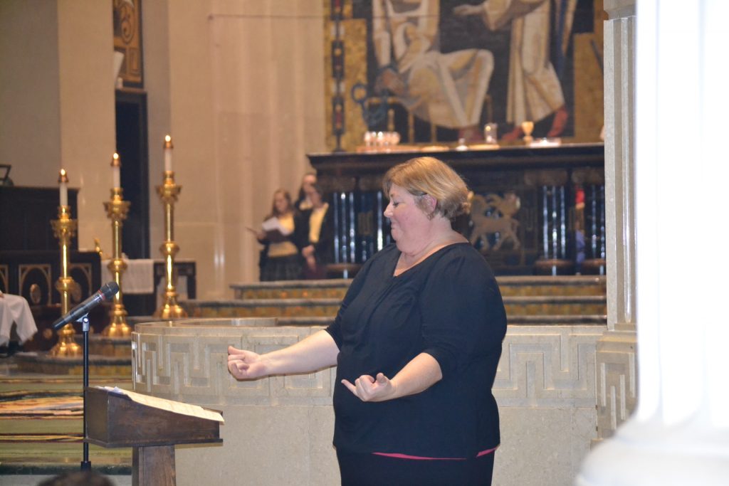 Signing at the Catholic Schools Week Mass (CT Photo/Greg Hartman)