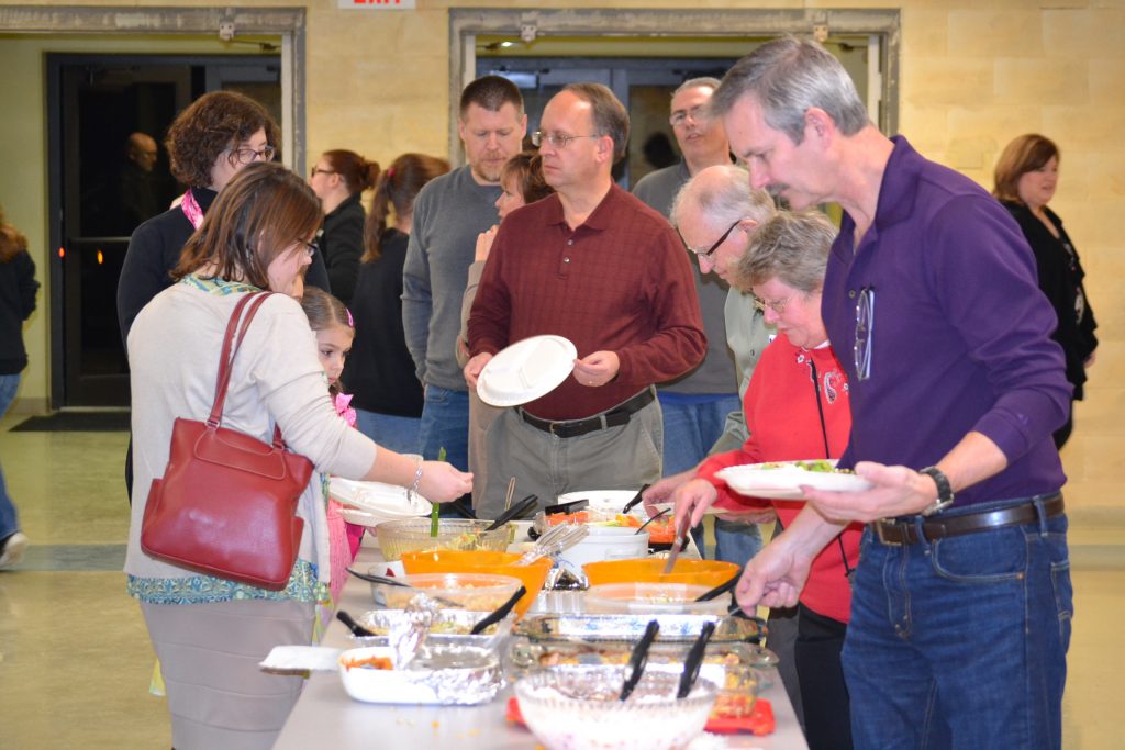 Guests line up for a feast of chicken and Vodka Penne (CT Photo/Greg Hartman)