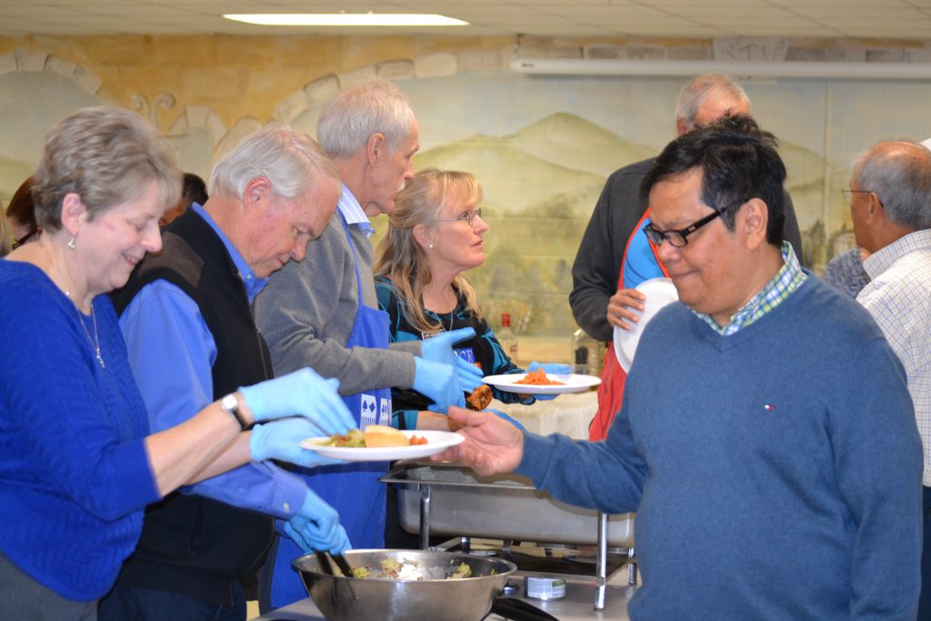 Guests enjoy Vodka Penne and Chicken for the main course (CT Photo/Greg Hartman)