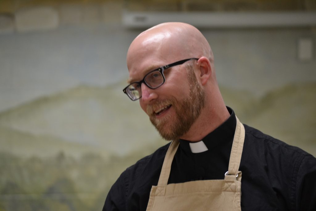 Father Kyle Schnippel during the "cook off" at St. John Neumann Parish (CT Photo/Greg Hartman)