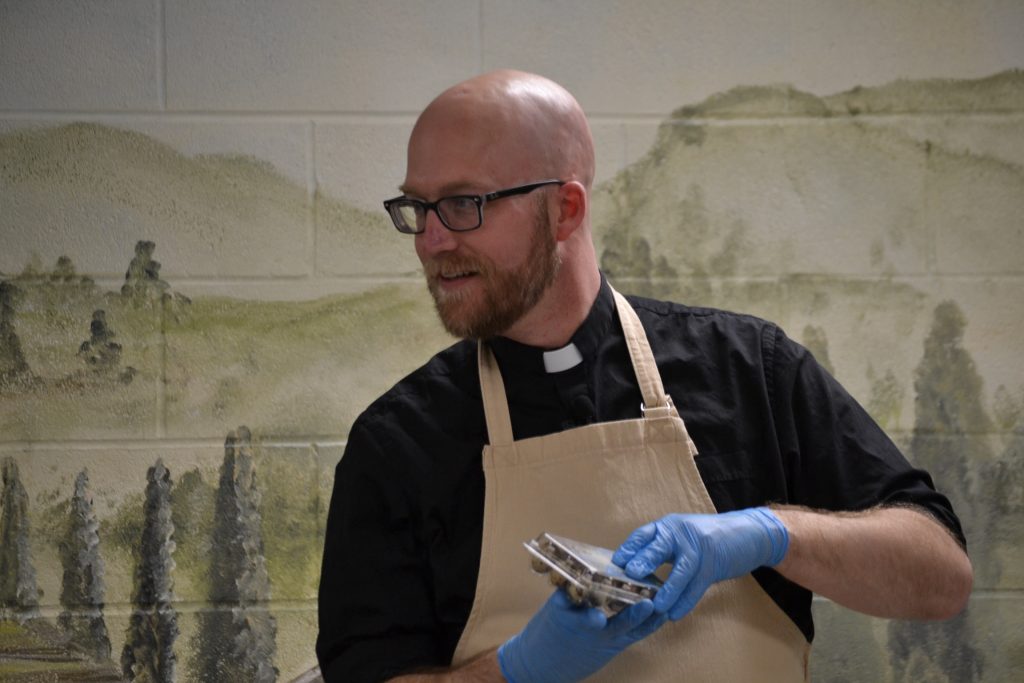 Father Kyle not so sure about quail eggs, yet excited for Grippo Barbeque Potato Chips (CT Photo/Greg Hartman