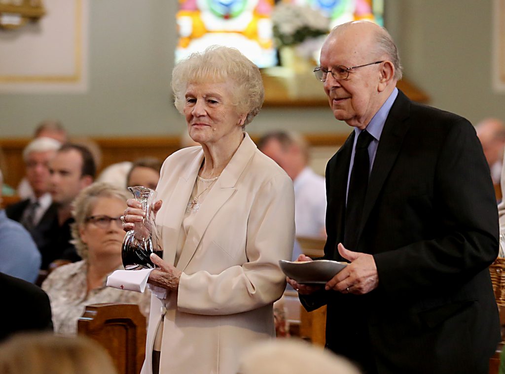 Dottie and Jim Bruck bear the Gifts during the 150th Anniversary Mass at St. Joseph Church in Hamilton Saturday, Sept. 16, 2017. (CT Photo/E.L. Hubbard)