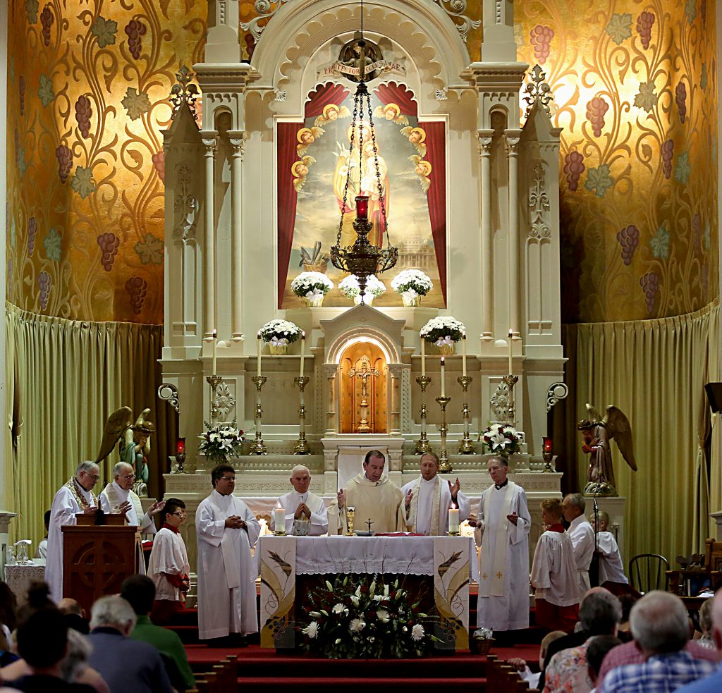 Archbishop Dennis Schnurr and the concelebrating priests prepare the Holy Eucharist during the 150th Anniversary Mass at St. Joseph Church in Hamilton Saturday, Sept. 16, 2017. (CT Photo/E.L. Hubbard)