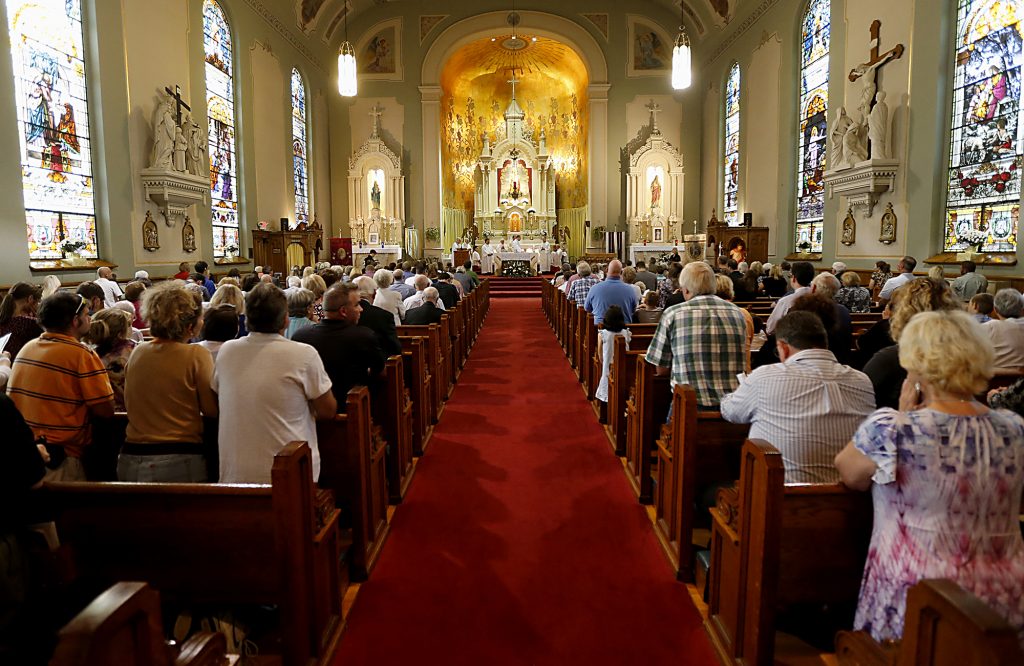 Archbishop Dennis Schnurr and the concelebrating priests prepare the Holy Eucharist during the 150th Anniversary Mass at St. Joseph Church in Hamilton Saturday, Sept. 16, 2017. (CT Photo/E.L. Hubbard)