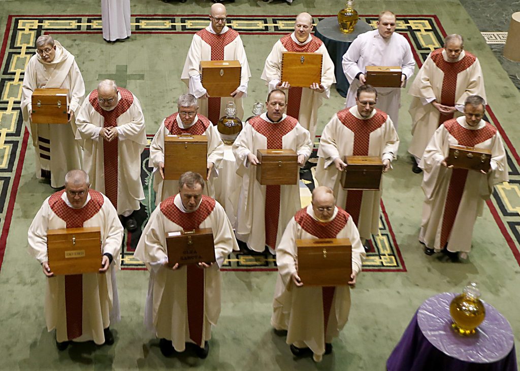 The Sacred Oils are distributed to a priest from each Deanery during the Chrism Mass at the Cathedral of Saint Peter in Chains in Cincinnati Tuesday, Mar. 27, 2018. (CT Photo/E.L. Hubbard)