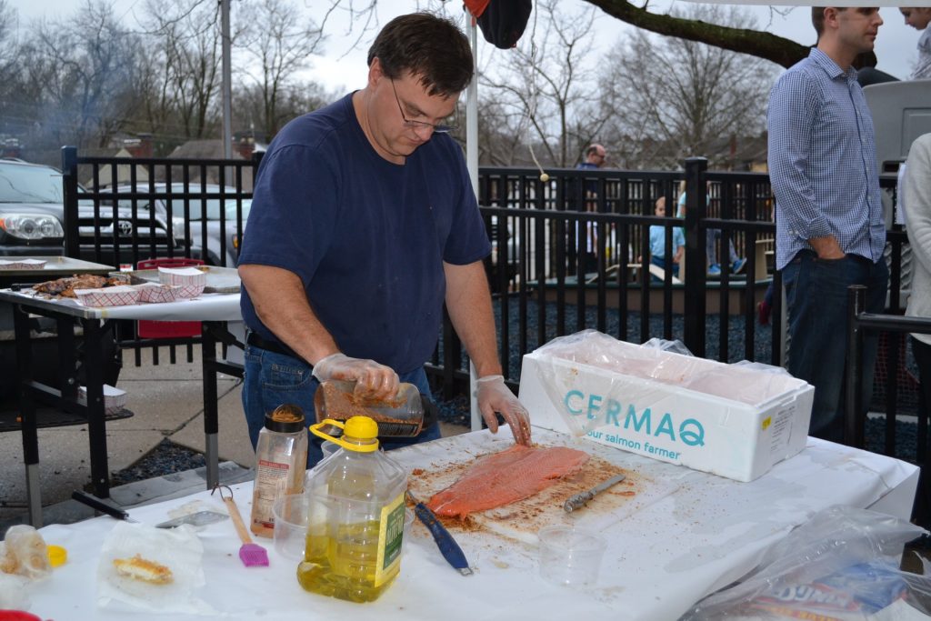 "Honey Badger" prepares fresh salmon for the Our Lord Christ the King/Cardinal Pacelli Fish Fry (CT Photo/Greg Hartman)