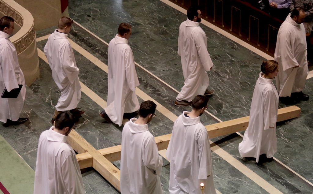 The Holy Cross lies in front of the Altar as the Choir of St. Peter in Chains Cathedral recesses during the Celebration of the Passion of the Lord at the Cathedral of St. Peter in Chains in Cincinnati on Good Friday, Mar. 30, 2018. (CT Photo/E.L. Hubbard)