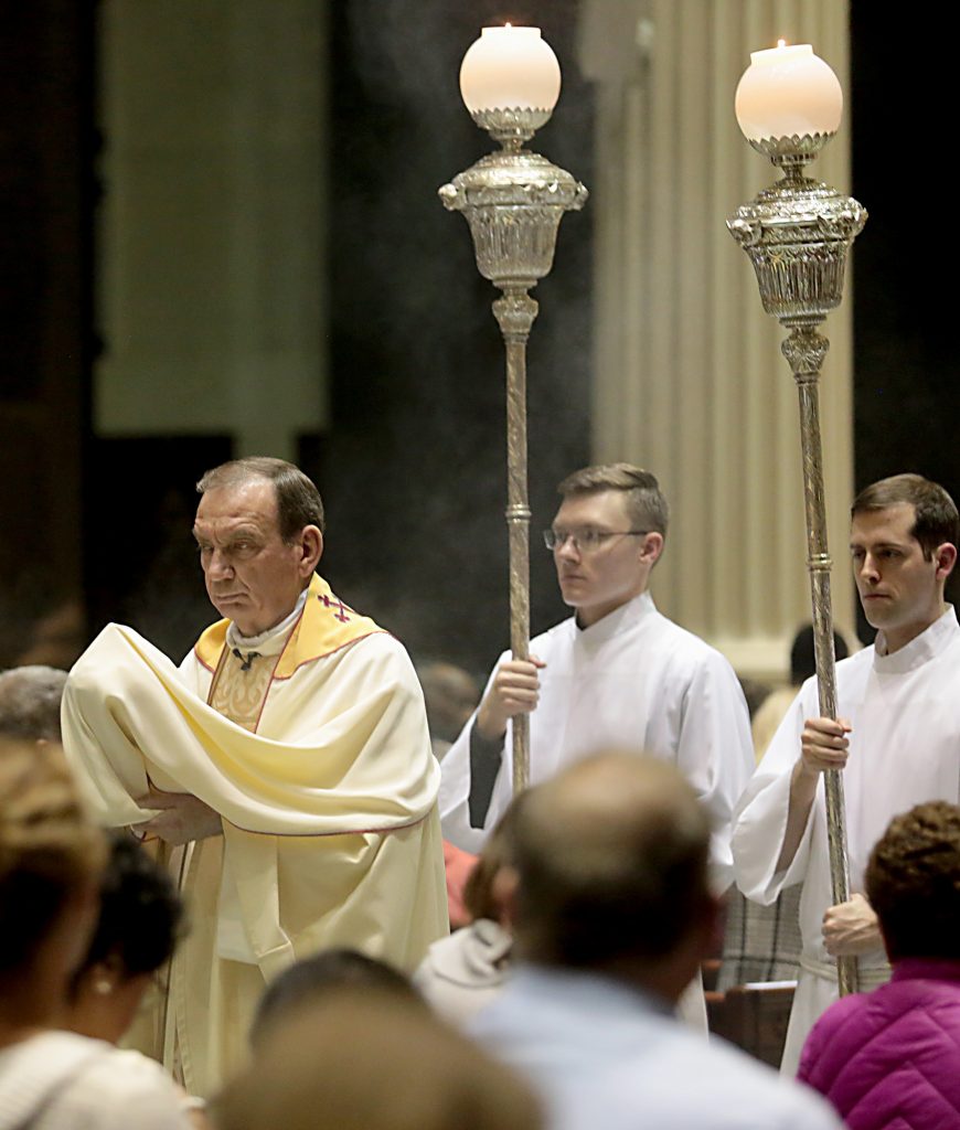 Archbishop Dennis Schnurr processes the Blessed Sacrament for the Transfer of the Most Blessed Sacrament .(CT Photo/E.L. Hubbard)