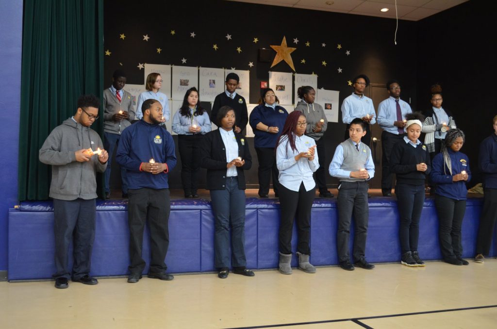 Students pray at DePaul Cristo Rey victims of gun violence and Purcell Marian student Gregory Thompson. (Courtesy Photo)