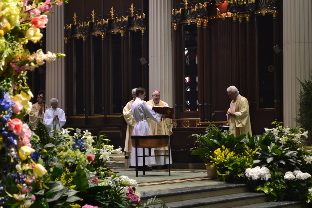 Bishop Joseph Binzer leads the Renewal of Baptismal Promises. (CT Photo/Greg Hartman)
