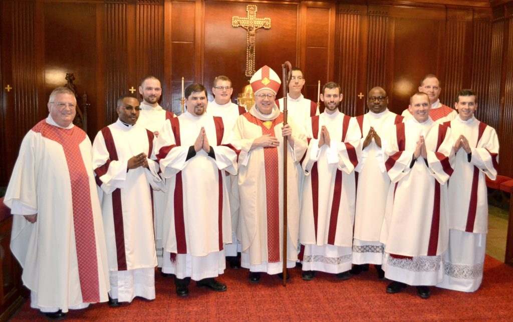 From left to right, Rev. Benedict O'Cinnsealaigh, Rev. Mr. Alex Biryomumeisho, Rev. Mr. Jedidiah Tritle, Rev. Mr. Mark Bredestege, Rev. Mr. Zachary Cecil, Bishop Joseph Binzer, Rev. Mr. Christian Cone-Lombarte, Rev. Mr. Ambrose Dobrozsi, Rev. Mr. Elias Mwesigye, Rev. Anthony Brausch, Rev. Mr. Jeffrey Stegbauer, and Rev. Mr. Andrew Hess (CT Photo/Greg Hartman)