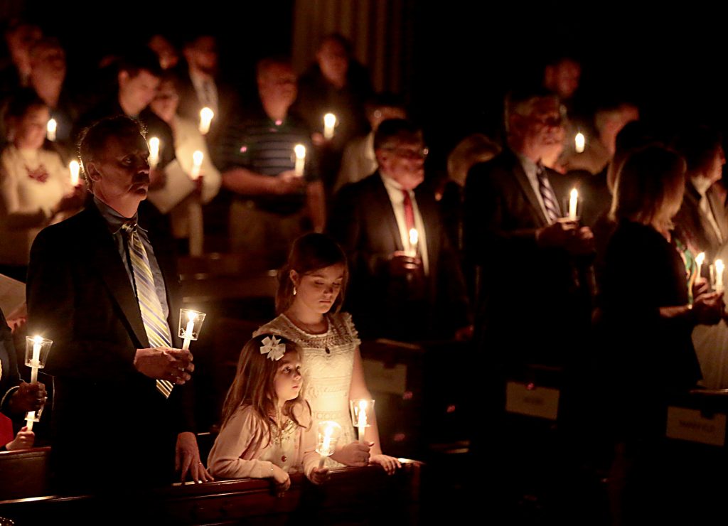 Parishioners hold candles for the Easter Vigil in the Holy Night at the Cathedral of Saint Peter in Chains in Cincinnati, Holy Saturday, March 31, 2018. (CT Photo/E.L. Hubbard)