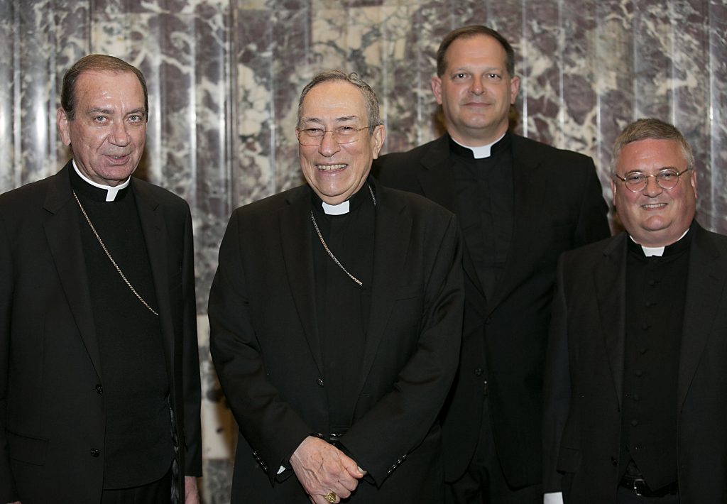 Archbishop Dennis Schnurr, Oscar Cardinal Rodriguez Maradiaga, of Honduras, incoming Rector Father Anthony Brausch, and outgoing Rector Father Benedict O’Cinnsealaigh, at the Bishop Fenwick Society dinner at the Hilton Cincinnati Netherland Plaza Hotel Friday, May 4, 2018. (CT Photo/E L Hubbard)