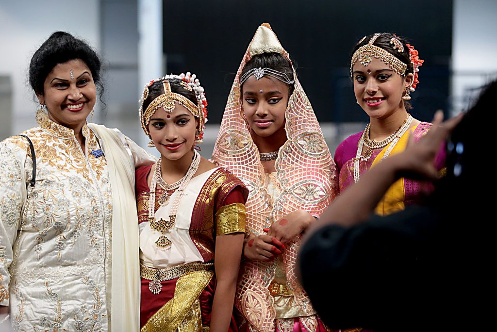 Four Hindu women pose for a snapshot during the first Festival of Faiths at the Cintas Center in Cincinnati Sunday, June 24, 2018. (CT Photo/E.L. Hubbard)