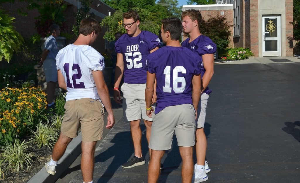 Members of the Elder Panther Football squad gather at St. Gertrude for the 2018 Sportsleader Rosary Rally (CT Photo/Greg Hartman)