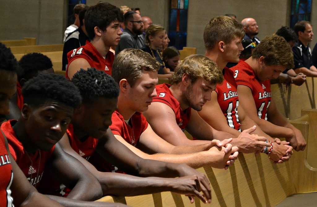 Men of La Salle pray the rosary at St. Gertrude (CT Photo/Greg Hartman)