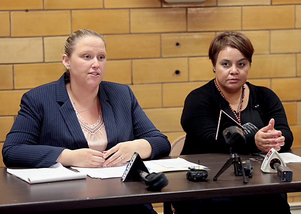 Maribel Trujillo Diaz, right, listens as one of her attorneys, Kathleen Kersh, speaks to the media after the Prayer of Thanksgiving at St. Julie Billiart Parish in Hamilton Tuesday, Sept. 25, 2018. (CT Photo/E.L. Hubbard)