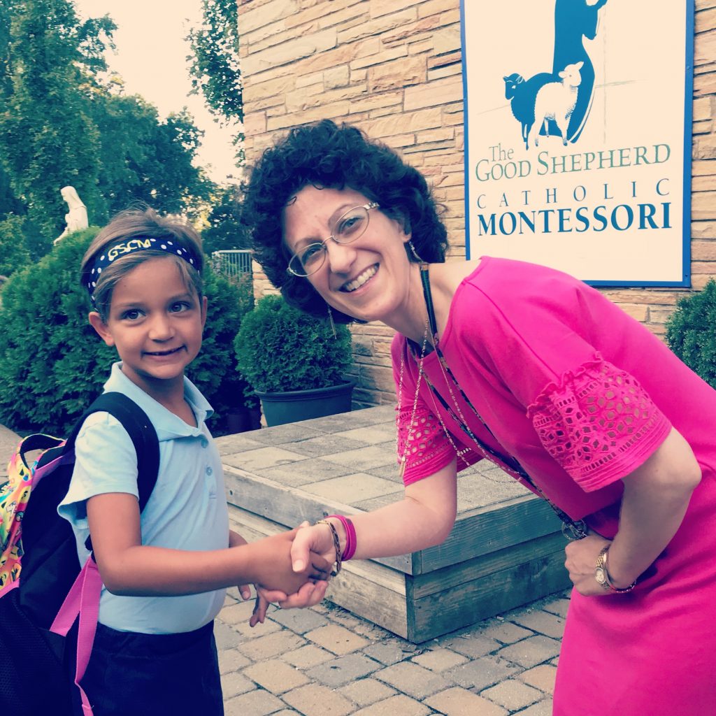 Principal Anne Marie Vega welcomes second grader Paisley Sanborn of Price Hill on the first day of school. (Courtesy Photo)