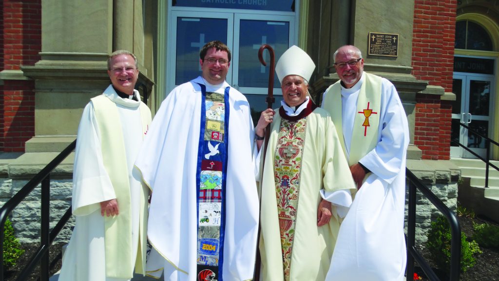 Pictured from left are Father Larry Hemmelgarn, provincial director; newly ordained Father Matt Keller; Bishop Joseph Charron, who presided at the June 9 Mass; and Father William Nordenbrock, moderator general. (Courtesy Photo)