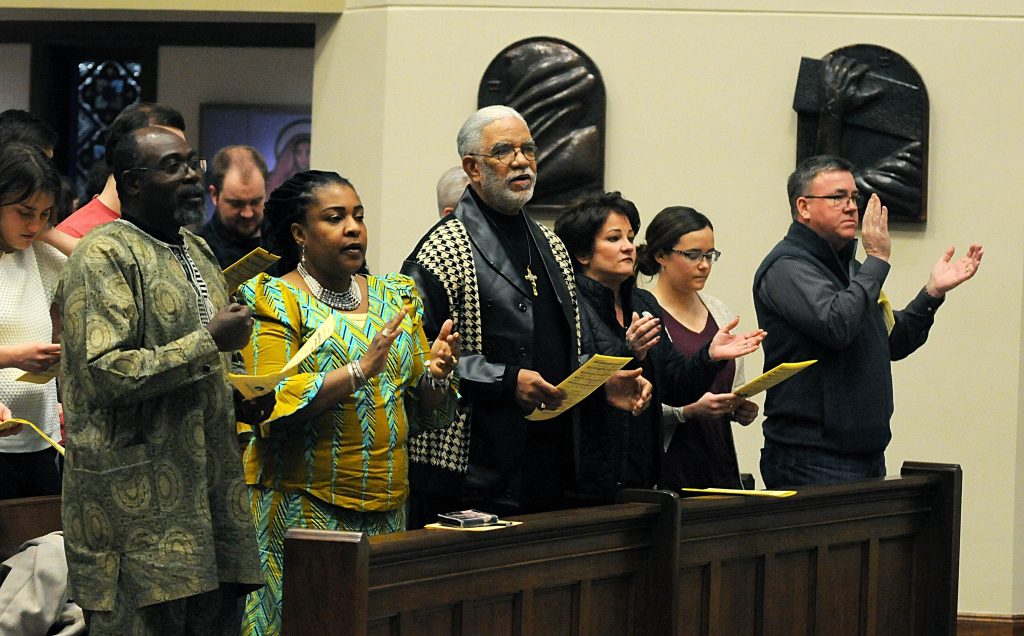 Members of the congregation sing the "Gathering Hymn" during the Unversity of Dayton's "Mass in Celebration of Black History Month" in the Chapel of the Immaculate Conception on Sunday, Feb. 10. (CT Photo/David Moodie)