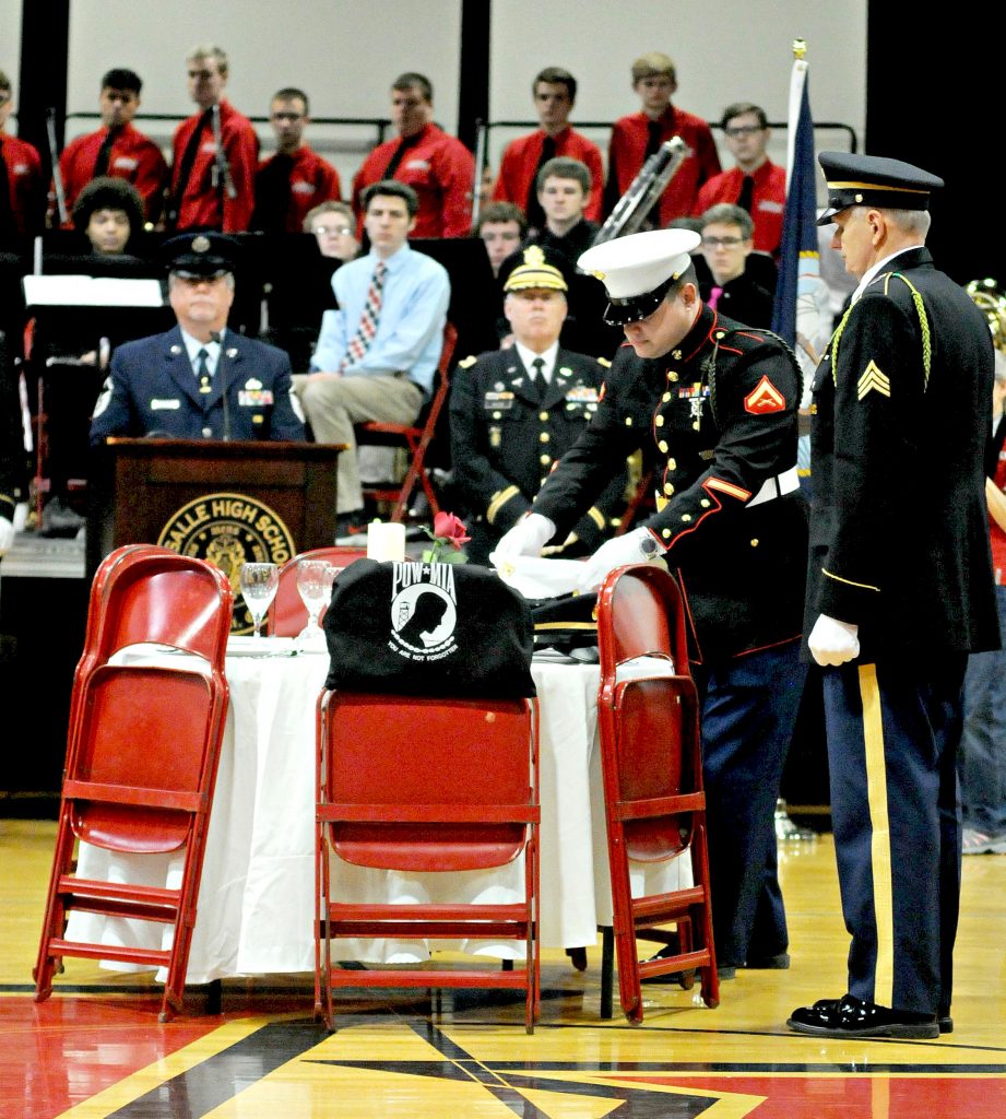 Members of the honor guard for the Green Twp. Veterans of Foreign Wars Post 10380 present "The Missing Man" Ceremony during La Salle High School's 5th Annual Veteran Appreciation Day on Tuesday, Feb. 12. The ceremony honors armed service and civilian personel who are listed as Missing In Action while serving in or with the United States military.(CT Photo/David Moodie)