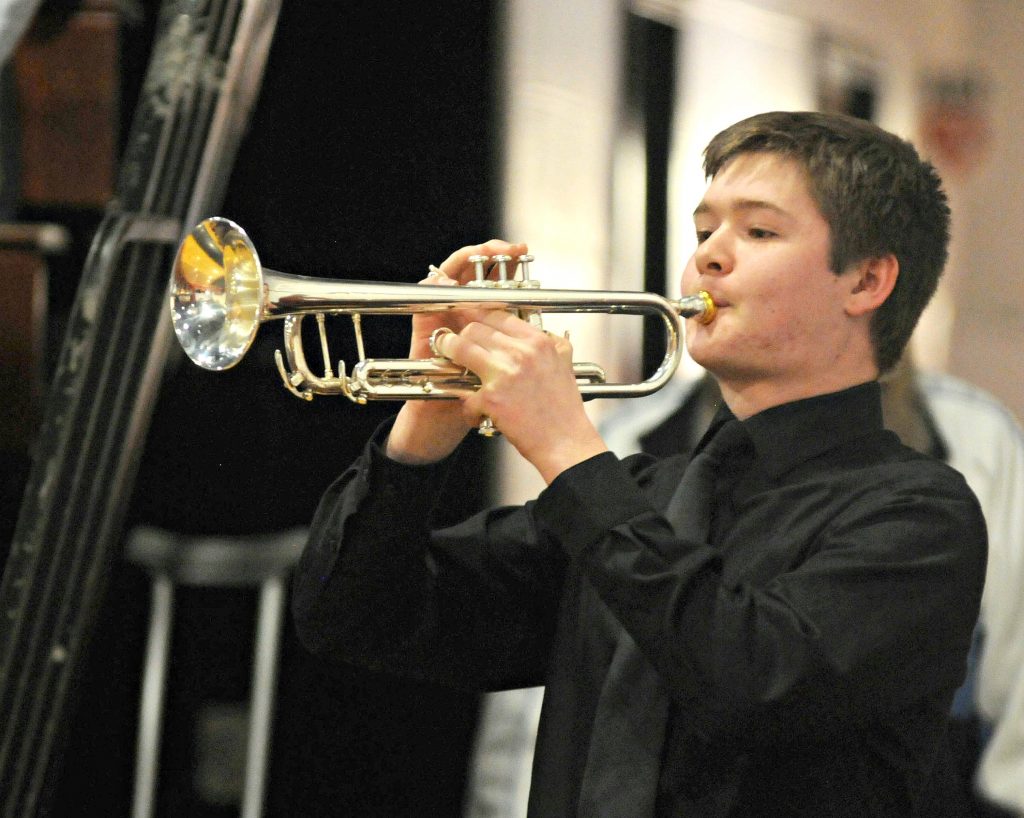 La Salle senior Nathaniel Behr plays "Taps" at the end of the school's 5th Annual Veteran Appreciation Day on Tuesday, Feb. 12. The program featured a presentation of the "Missing Man Ceremony," music and a keynote address by St. Ursula High School graduate United States Air Force Lt. Col. Angela F. Ochoa (CT Photo/David Moodie)