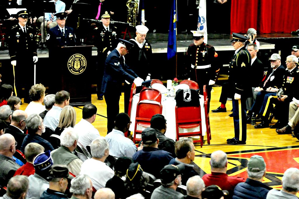 Members of the honor guard for the Green Twp. Veterans of Foreign Wars Post 10380 present "The Missing Man" Ceremony during La Salle High School's 5th Annual Veteran Appreciation Day on Tuesday, Feb. 12. The ceremony honors armed service and civilian personel who are listed as Missing In Action while serving in or with the United States military.(CT Photo/ David Moodie)