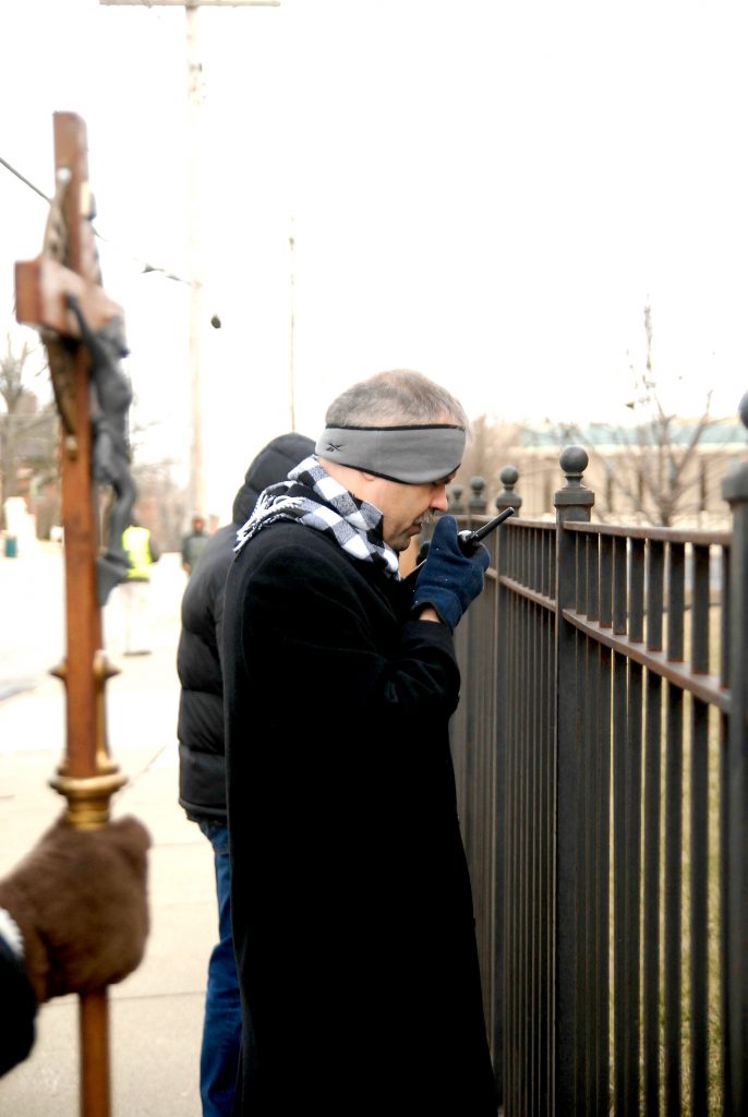 Father James Ruter(cq) from St. Peter's Church in New Richmond, OH, leads the praying of the rosary in front of Planned Parenthood's Auburn Ave. Surgical Center on Saturday, Feb. 16. Members of "Helpers of God's Precious Infants" have a prayer vigil to end abortion in front of the center the first, third and fourth Saturday of each month. A similar vigil is held at Planned Parenthood's Wester Hills center on the second Saturday of each month. (CT Photo/David A. Moodie)