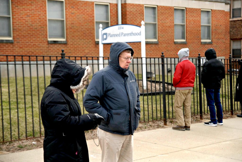 Colleen and Dr. Arthur Kunath, MD pray the rosary in front of Planned Planned Parenthood's Auburn Ave. Surgical Center on Saturday, Feb. 16. Members of "Helpers of God's Precious Infants" have a prayer vigil in front of the center the first, third and fourth Saturday of each month. The group has a similar vigil at Planned Parenthood's Western Hills center on the second Saturday of the month. (CT Photo/David A Moodie)