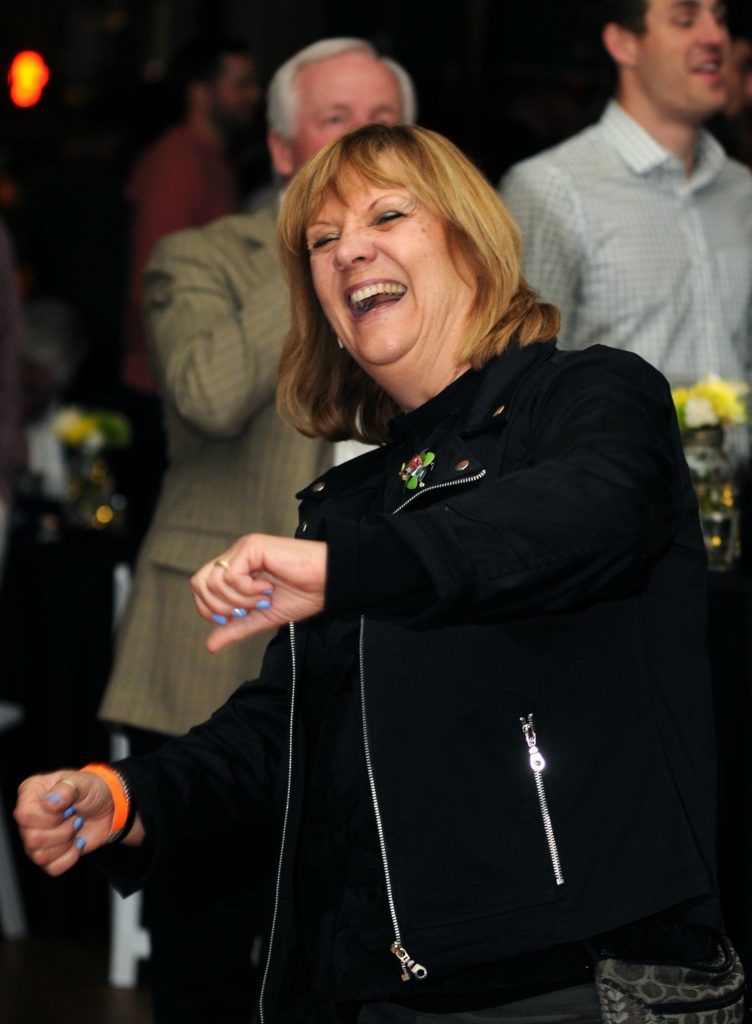 Pam Ives takes a turn on the dance floor during the Catholic Inner City Schools Education (CISE) fundraiser at the Woodward Theater in Over the Rhine on Saturday, April 6. CISE raises funds for the eight urban Catholic schools in the Archdiocese of Cincinnati. This year's event featured live music, a silent auction, raffle, food and an open bar. CISE hopes to raise $100,000 with the event, which is in its ninth year. (CT Photo/David A. Moodie)