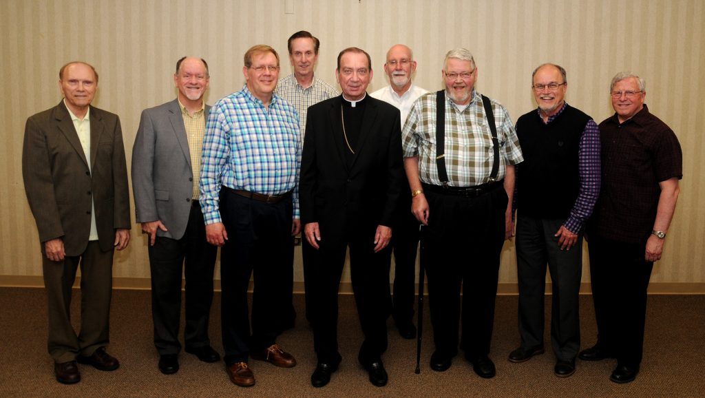 Archbishop Dennis M. Schnurr, center, stands with members of the Ordination Class of 1979, during the Archdiocese of Cincinnati's annual Ordination Anniversasry Dinner at the Bergamo Center in Beavercreek, Ohio on Monday, May 6. Members of the class include: Front L-R Fathers Terry Schneider, Jerry Gardner, Jeff Kemper. Marc Sherlock, Jim Schutte, and Dave Lemkuhl. Back L-R Fathers Larry Tensi and Len Wenke. (CT Photo/David A. Moodie)